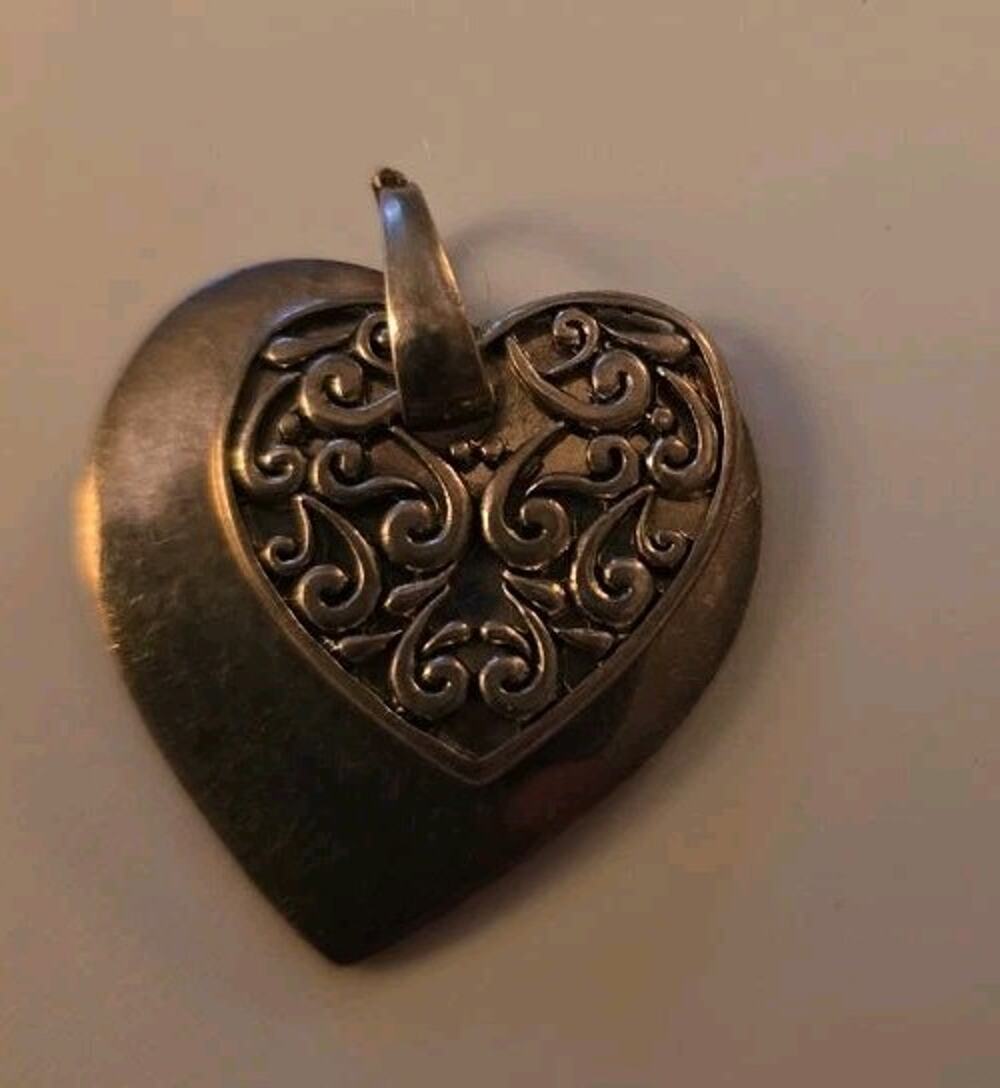 Vintage Heart-Shaped Metal Pendant with Ornate Design